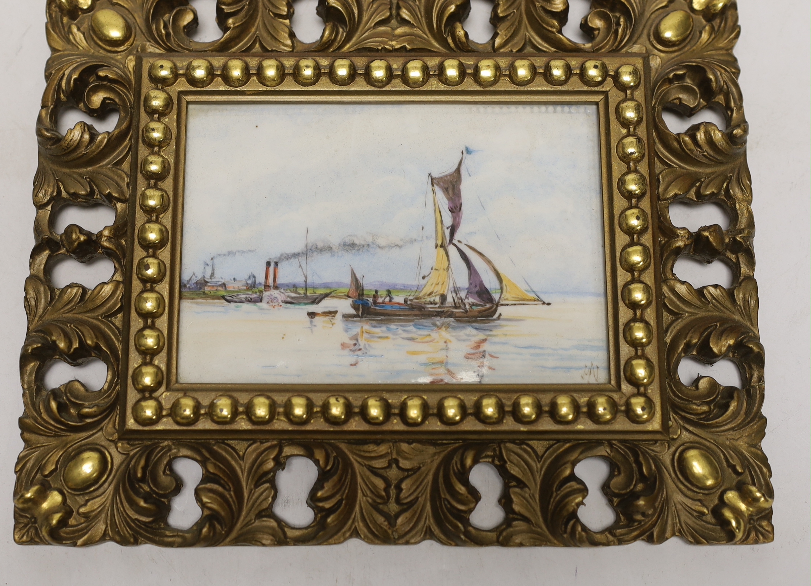 A pair of gilt framed painted porcelain plaques, indistinctly signed, 10x14cm excluding frame